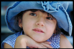 Casual Head and Shoulders Portrait of a young girl wearing a den