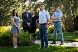 Casual outdoor Family Portrait of two parents and three adult ch