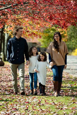 Outdoor Family Portrait of two parents and two young daughters a