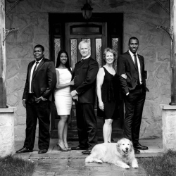 Formal Black and White Family Portrait of Two parents and three