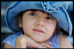 Casual Head and Shoulders Portrait of a young girl wearing a den