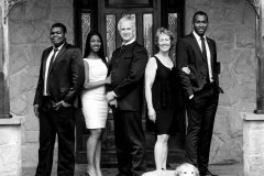 Formal Black and White Family Portrait of Two parents and three