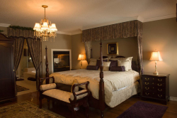 Photograph of residential interior of master bedroom with ensuit
