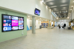 Photographs of illuminated advertising in indoor sports faciliti