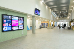 Photographs of illuminated advertising in indoor sports faciliti