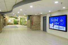 Photographs of illuminated advertising in indoor sports faciliti