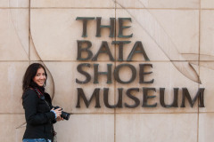 Maruan Diaz standing next to The Bata Shoe Museum signage in Tor